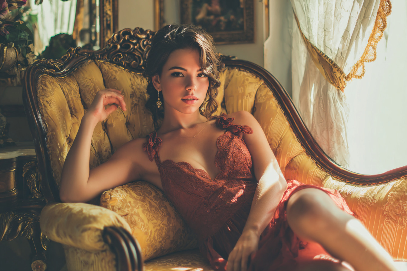 Trophy wife relaxing on a couch
